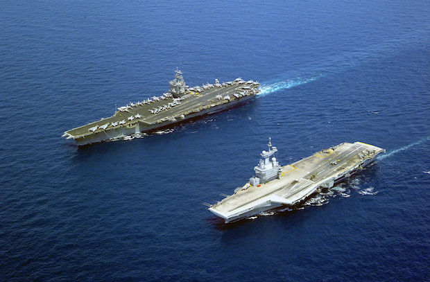 Photo: The French nuclear-powered aircraft carrier Charles de Gaulle and the American nuclear-powered carrier USS Enterprise (left), each of which carry nuclear-capable fighter aircraft | Credit: Wikimedia Commons