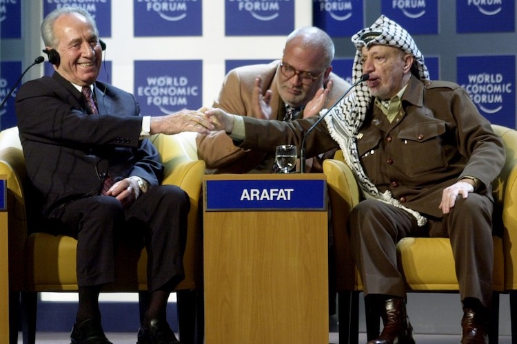 Photo: Twenty-five years since the 1994 Nobel Peace Prize shared by Prime Minister Yitzhak Rabin and Israeli Foreign Minister Shimon Peres with PLO Chairman Yasser Arafat – who negotiated and signed the Oslo Peace Accords – peace continues to evade the Middle East, Palestine-Israel relations remain tense and a Weapons of Mass Destruction (WMD) Zone in the region is nowhere in sight. The picture shows Rabin (left) shaking hands with Arafat (right) at the World Economic Forum in Davos, 2001 | Credit: CC BY-SA World Economic Forum.