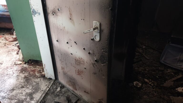 "A fortified room in a house in Be'eri, an Israeli kibbutz near the Gaza Strip, tells a harrowing story. Inside, a couple with two children desperately held the door shut to keep terrorists out. The militants began shooting through the door, tragically killing the mother on the spot. Her young son also succumbed to his wounds from severe blood loss shortly afterward. The teenage daughter heroically managed to save her father's life by staunching the bleeding. Although his leg was amputated, he survived. Inside the room, there is a mattress soaked in blood, numerous stains on the floor, and bullet holes riddling the walls—a testament to the brutal reality faced by those living in the kibbutz". Photo by Roman Yanushevsly.