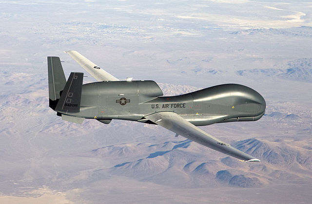 An RQ-4 Global Hawk unmanned aircraft like the one shown is currently flying non-military mapping missions over South, Central America and the Caribbean at the request of partner nations in the region./ By U.S. Air Force photo by Bobbi Zapka, Public Domain
