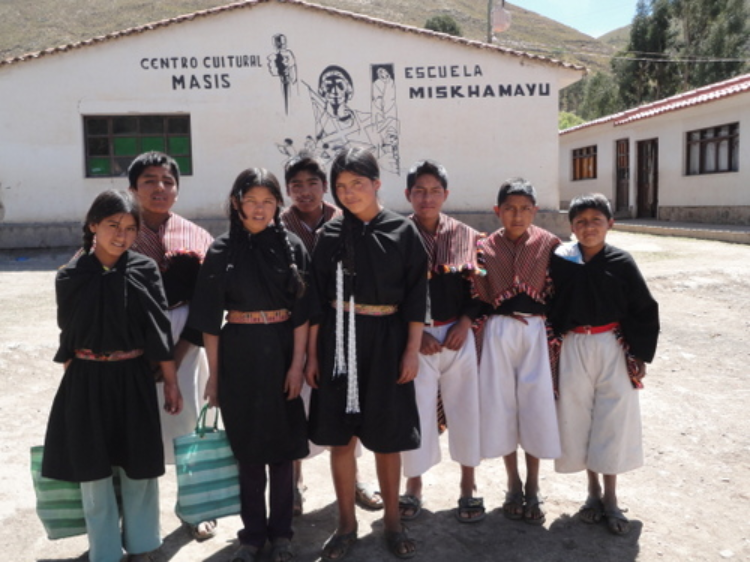 A group of indigenous children in the last year of primary school, standing in front of the Miskhamayu school. Credit: Marisabel Bellido/IPS