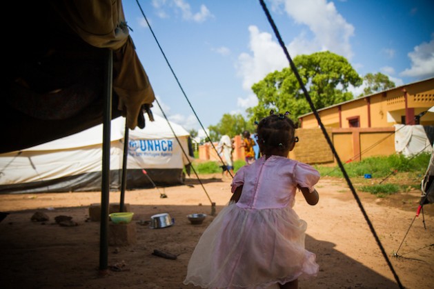 A girl playing in a United Nations Refugee Agency camp in Ouagadougou, Burkina Faso in February 2013. Refugees here fled their native Mali in March 2012 when Islamist groups took control of the north of the country. Credit: Marc-André Boisvert/IPS