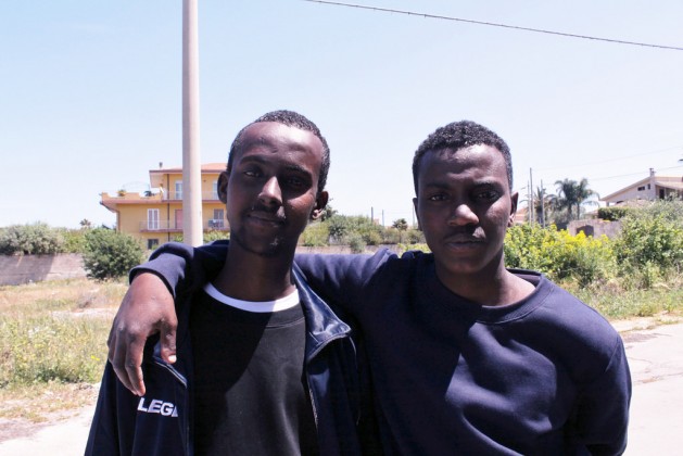 Mohammed (left) and Ahmed, two Somali migrants who survived crossing the Mediterranean and are now hosted in one of Syracuse’s first aid and reception centres, although they are not planning to remain in Italy for long. Credit: Silvia Giannelli/IPS