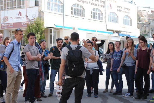 ‘Breaking The Silence’ takes a group on a tour of Hebron where they learn first hand about life under occupation. Credit: Mel Frykberg