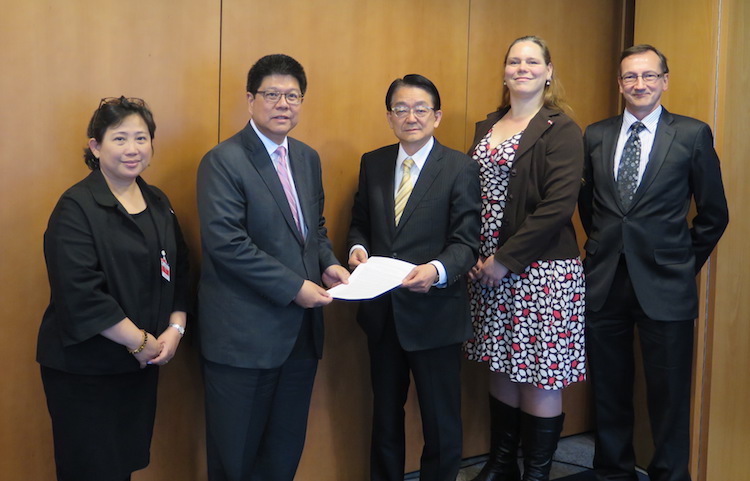 OEWG Chair Ambassador Thani Thongphakdi (second from left) receiving an interfaith statement on May 3 from representatives of PAX, the SGI and the WCC. From right to left: Peter Prove of the WCC, Susi Snyder of PAX and Hirotsugu Terasaki of the SGI. Credit: SGI | Kimiaki Kawai