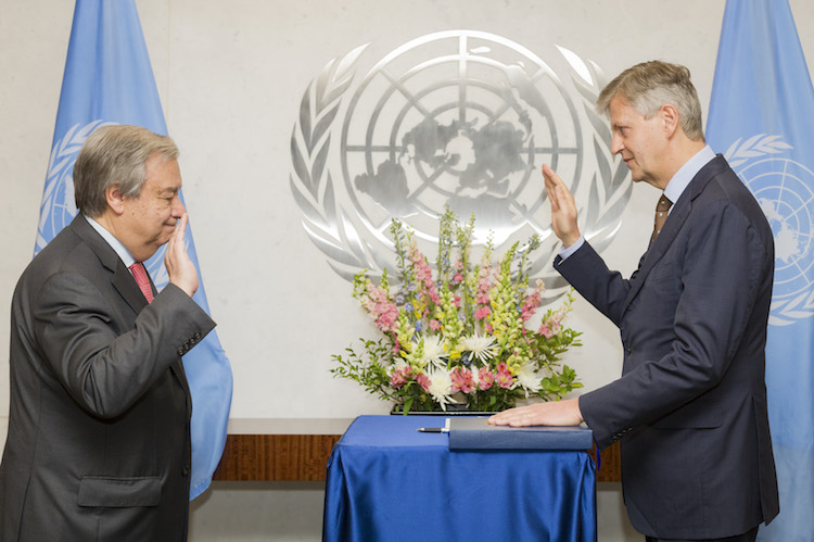 UN Secretary-General António Guterres (left) swears in Jean-Pierre Lacroix, Under-Secretary-General for Peacekeeping Operations. 12 April 2017. United Nations, New York. /UN Photo/Rick Bajornas.