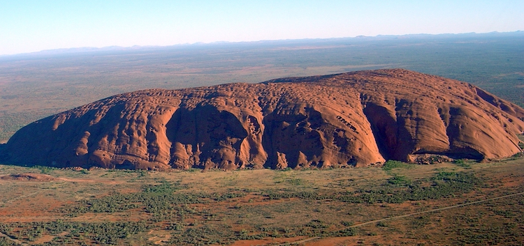 Image: Uluru rock in Central Australia. Indigenous Australians met in a historic summit overlooking it on May 24-26. Credit: Wikimedia Commons.