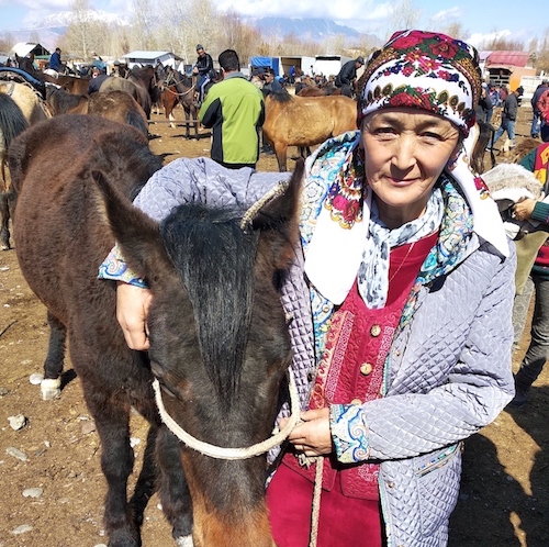 Andakulova Gulmeera with the horse. 