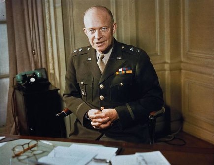 The Commander of American Forces in the European Theatre, Major General Dwight Eisenhower, at his desk./ By Official photographer, Public Domain