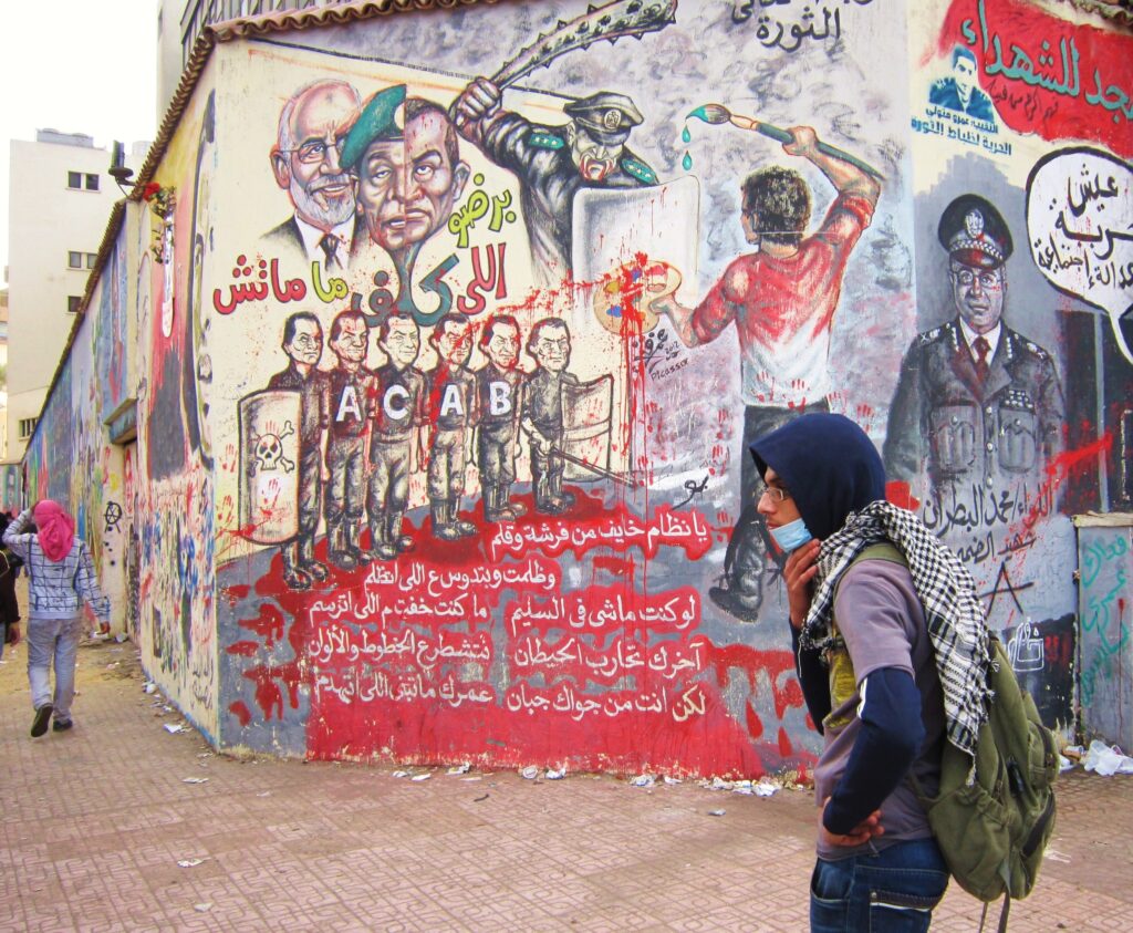 Graffiti in Cairo showing police brutality. Credit: Cam McGrath/IPS
