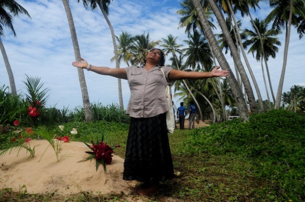 A woman wails near the location of a mass grave in the village of Peraliya in southern Sri Lanka. Thousands continue to struggle with trauma and depression, ten years after the disaster. Credit: Amantha Perera/IPS