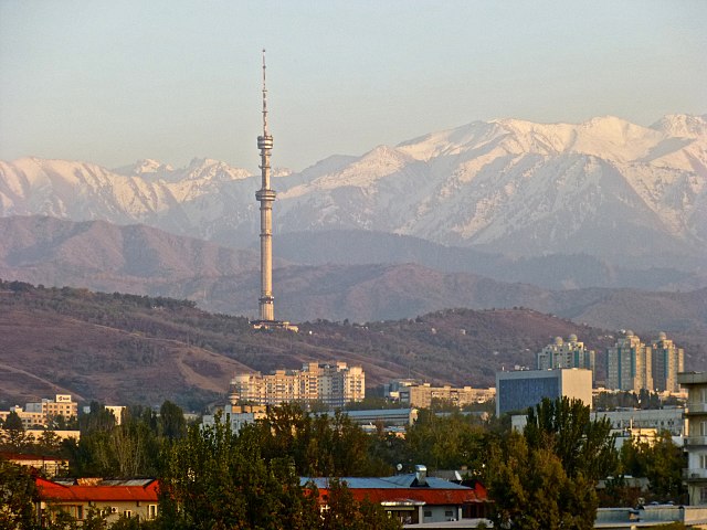 TV-Tower in Almaty, Kazakhstan, view from downtown to southeast. The second peak in the left of the tower is the Koptau, 4152 metres./ By Michael Grau - Own work, CC BY-SA 3.0,