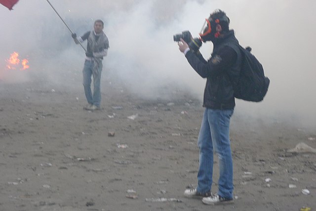 A photojournalist in a gas mask on Mansour Street during protests near the Ministry of Interior in central Cairo in February 2012. Later, in 2014, a reporter commented that a gas mask was the only free piece of safety equipment provided to him by his newspaper ( www.thecairopost.com/news/106461/inside_egypt/reporter-li... ) but in 2012 I think even these were still mostly bought by journalists themselves.