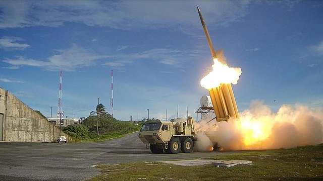 The first of two Terminal High Altitude Area Defense (THAAD) interceptors is launched during a successful intercept test/ By The U.S. ArmyRalph Scott/Missile Defense Agency/U.S. Department of Defense - Successful Mission, Public Domain